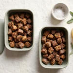 Crispy beef navel bites portioned into glass meal-prep containers