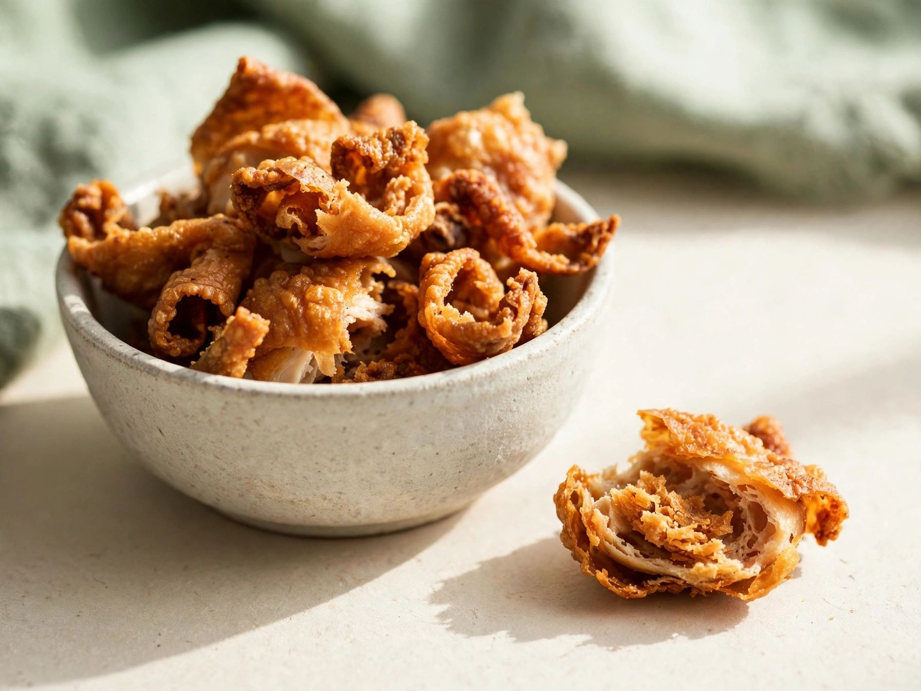 Bowl of crispy chicken cracklings, the only truly zero-carb crunchy snack