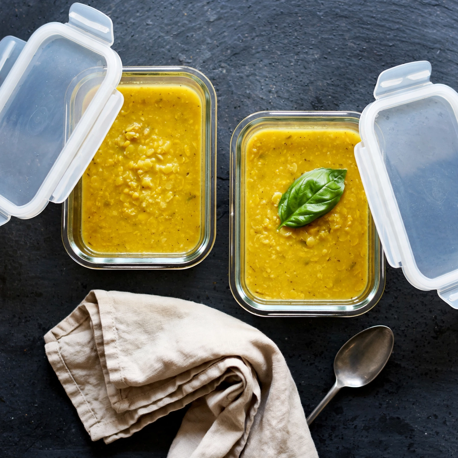 Gut healing moong dal soup packed into glass meal-prep containers