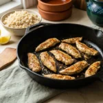 Mediterranean brown rice bowl chicken searing in a skillet
