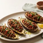 Mediterranean stuffed eggplant with ground beef, roasted and filled with tomato-beef sauce
