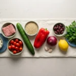 Raw ingredients for a Mediterranean turkey bowl arranged for cooking