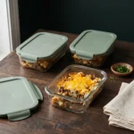 Portions of keto beef and cauliflower casserole packed into glass meal prep containers