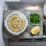 Greek eggplant dip stored in a sealed glass container